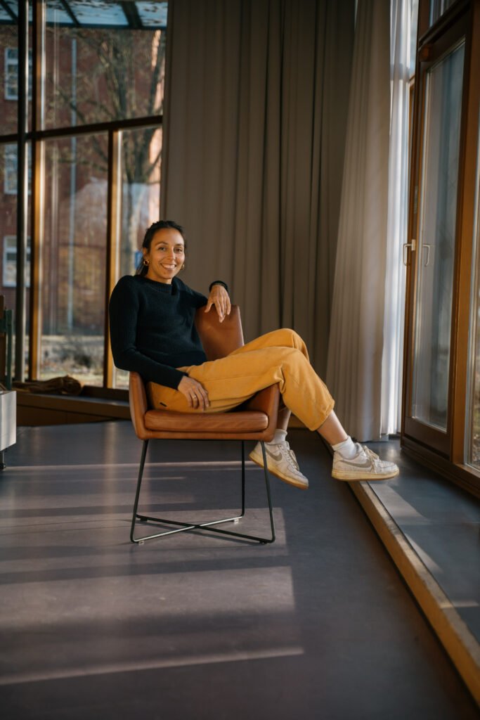 Image of founder Miriam in a Chair